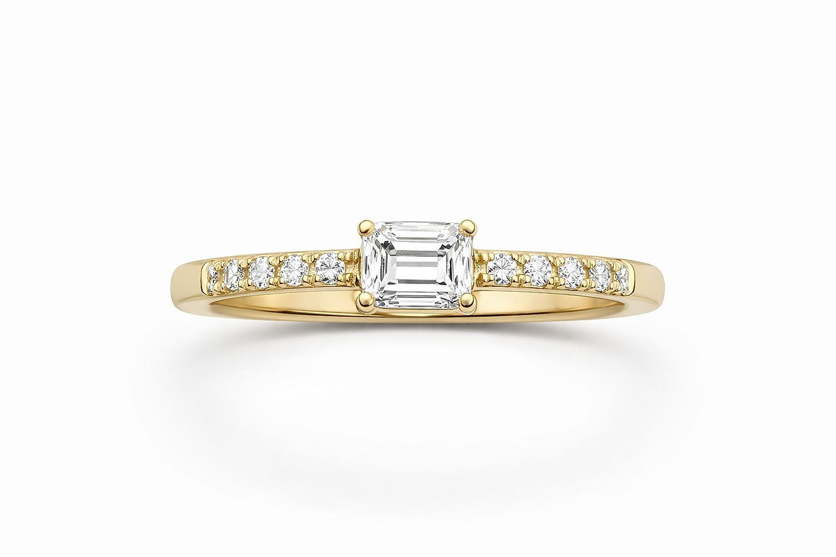 18KT Yellow Gold Diamond Engagement Ring With All Natural Stones. Center Stone Is A 0.59CT Emerald Cut , Diamonds On The