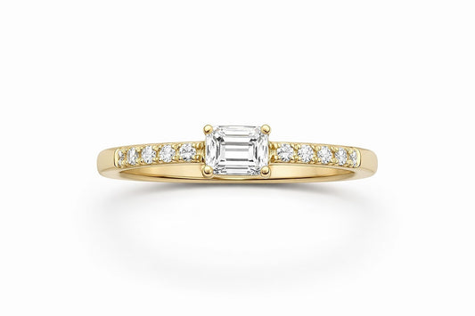 18KT Yellow Gold Diamond Engagement Ring With All Natural Stones. Center Stone Is A 0.59CT Emerald Cut , Diamonds On The
