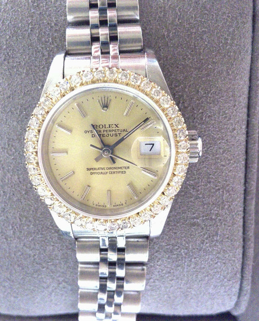Pre-Owned Ladies Stainless Steel Datejust 69174 with Jubilee Bracelet and Champagne Dial with Silver Markers. Aftermarket Diamond Bezel. Any Box Is Aftermarket