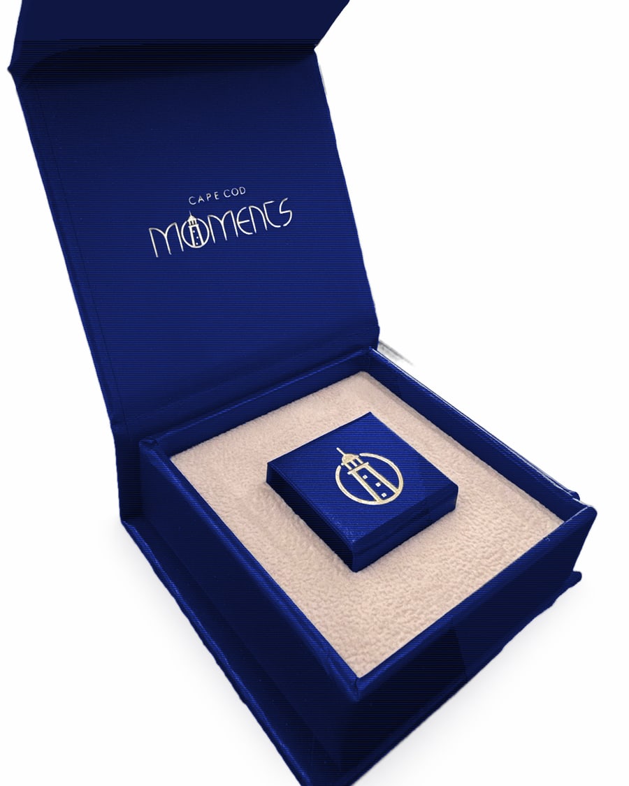 Cape Cod Moments navy gift box open, with the small lighthouse box inside