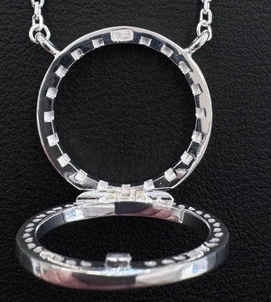 The back of the necklace with the clasp swung open on its hinge